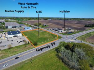 An aerial shot of land. There are multiple landmarks labeled: Tractor Supply, West Hennepin Auto & Tire, Holiday, and SITE.