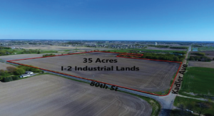 An aerial view of land outlined in red and labeled, "35 Acres I-2 Industrial Lands." The land outlined is alongside 80th St and Kadler Ave in Otsego, MN.